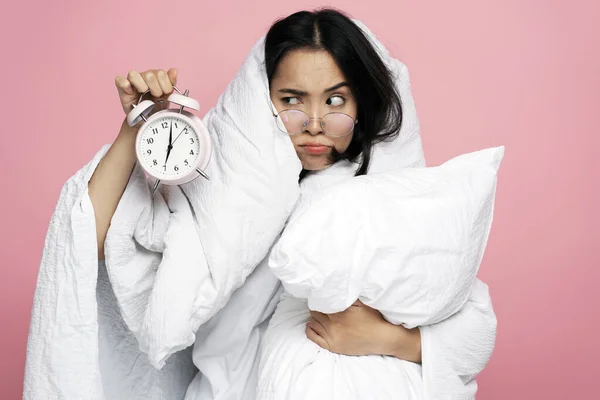 Annoyed Asian Woman Hugging Pillow Holding Alarm Clock Sad Face — Stock Photo, Image