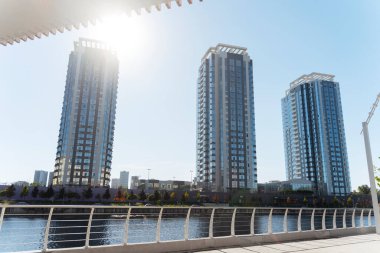 High skyscrapers and river landscape at the sunny summer day. Architecture concept. Stock photo 