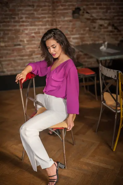 Beautiful Young Brunette Woman Purple Blouse White Pants Posing Indoor Royalty Free Stock Photos