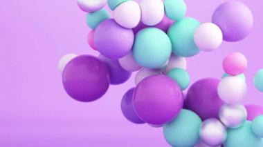 Süzülen ve çarpışan yumuşak renkli topların 4K döngü animasyonu.