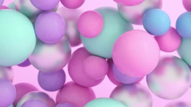 Süzülen ve çarpışan yumuşak renkli topların 4K döngü animasyonu.