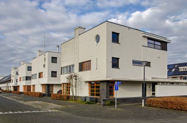 Tilburg, The Netherlands, January 14, 2025: row of four semi-detached houses in white brock reto style in Koolhoven neighbourhood clipart