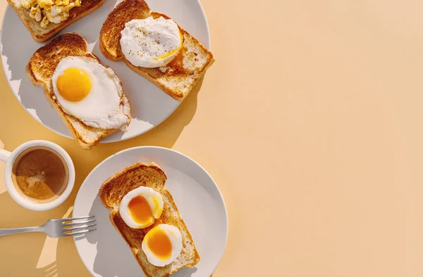 stock image fried Toast bread with four different types of cooked chicken eggs, scrambled eggs, fried eggs, poached egg and creamed egg. Breakfast of chicken eggs.