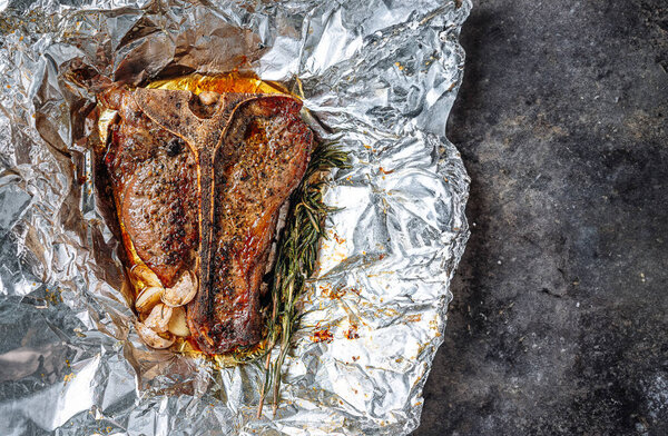 Freshly Cooked Juicy Bone Steak Rosemary Garlic Spices Light Marble Royalty Free Stock Images