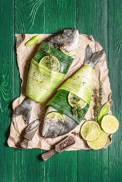 Two Fresh Raw Dorado Fish Wrapped Palm Leaves Sprinkled Mixture Royalty Free Stock Photos