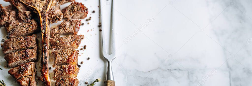 Freshly Cooked Juicy Bone Steak Rosemary Garlic Spices Light Marble Royalty Free Stock Images