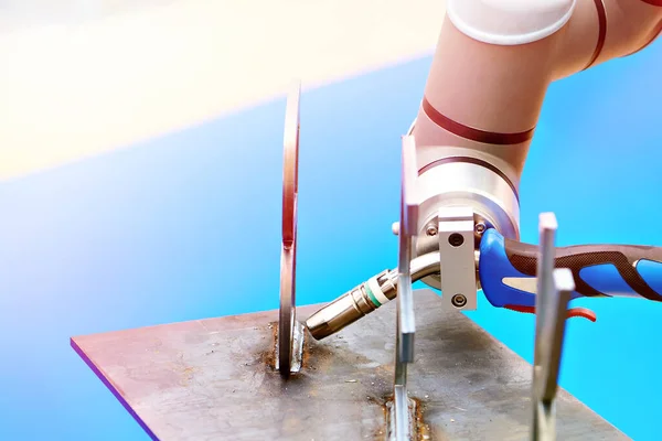 Robot manipulator arm with welding on exhibition