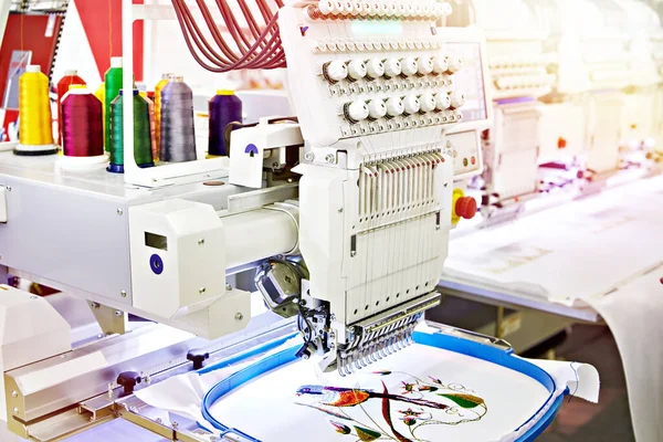 Embroidery industrial machine in sewing workshop