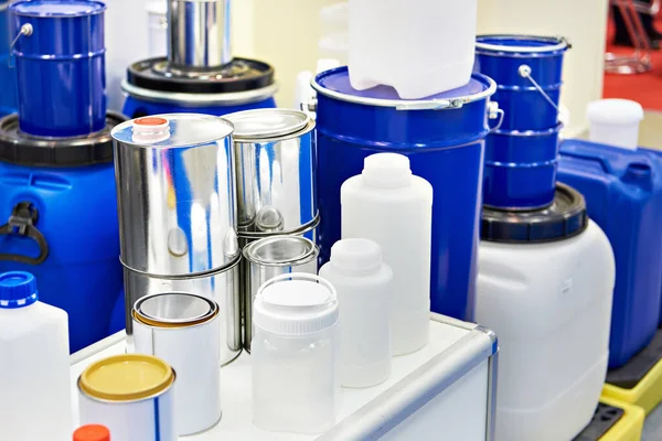 Metal and plastic containers for paint at the exhibition