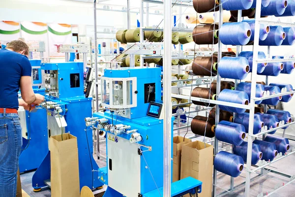 Bobbins of thread for a cord knitting machine