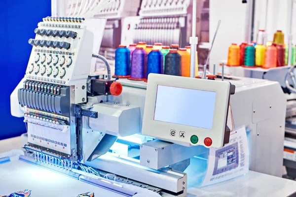 Embroidery industrial machine in sewing workshop