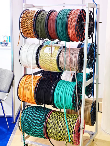 Bobbins of colored rope on display in a store