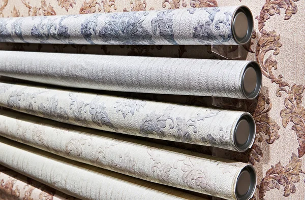 Rolls of wallpaper on a showcase in a store