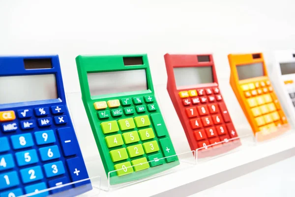 Colorful calculators on a showcase in a stationery store