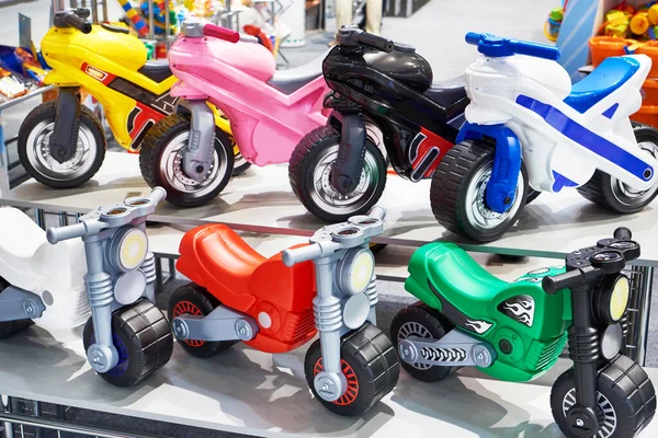 Plastic bicycles in a toy store