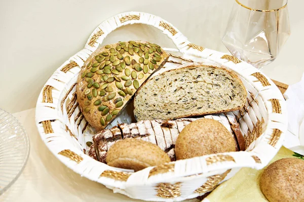 Bread with pumpkin seeds, buns and dishes