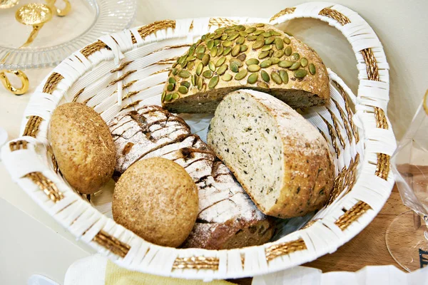 Bread with pumpkin seeds, buns and dishes