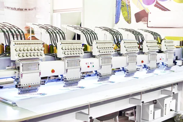 Industrial embroidery machines in a sewing workshop