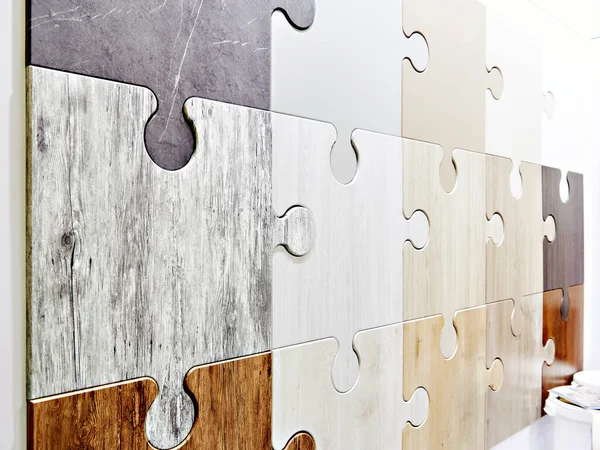 Puzzle shape wooden panels on wall in store