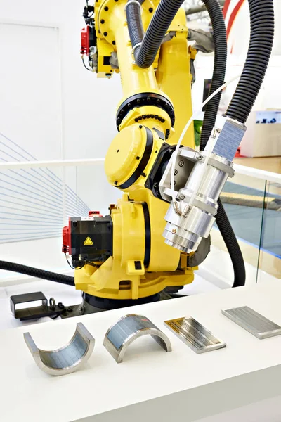Robot manipulator with laser attachment for measurements