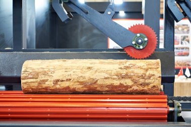 Log in wood working machine in factory clipart