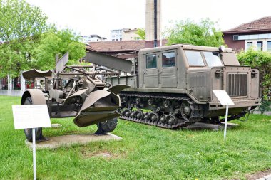 Sofia, Bulgaria, April 24, 2024; Artillery tractor ATS-712 and attached mine installing machine PMR-3 in military museum clipart