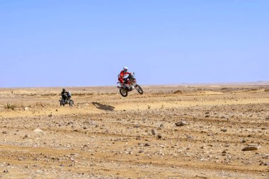 Al-Kharj, Saudi Arabia - January 10, 2023: Neels Theric (No. 114) from RS Concept Team and Julian Jagu (No. 63) from Drag'On Rally Team running Stage 9 of rally Dakar 2023 edition clipart