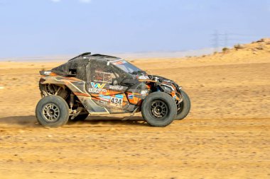 Al-Kharj, Saudi Arabia - January 10, 2023: The MMP Can-Am running Stage 9 of the Dakar Rally 2023 Edition. clipart