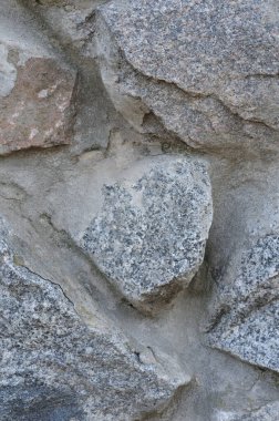 Taş duvar dokusunun arka planı. Taş bir duvarın yakın plan görüntüsü.