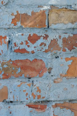 Boya soyulmuş eski tuğla duvar. Tasarım için soyut arkaplan.
