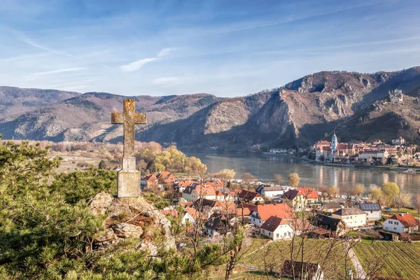 Cross bearing the name: God protect me against Durnstein village with Danube river in Wachau valley (UNESCO), Austria