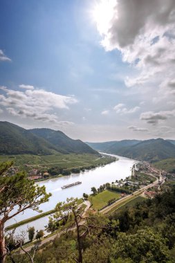 Wild nature of Wachau Valley (Unesco world heritage site) with boat on Danube river near the Spitz village in Lower Austria, Austria clipart