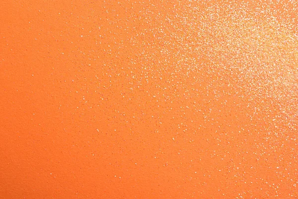 Turuncu arka planda parlak parlak parıltı, düz yatış. Metin için boşluk