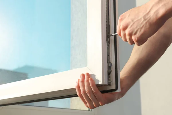 Worker Adjusting Installed Window Screwdriver Indoors Closeup — Stockfoto