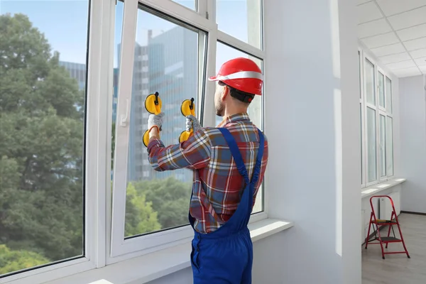 Worker Using Suction Lifters Plastic Window Installation Indoors — 스톡 사진