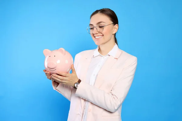 Happy Young Businesswoman Piggy Bank Light Blue Background — Stok Foto