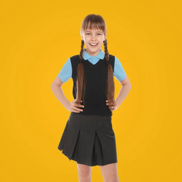 Retrato Linda Chica Con Uniforme Escolar Sobre Fondo Amarillo —  Fotos de Stock