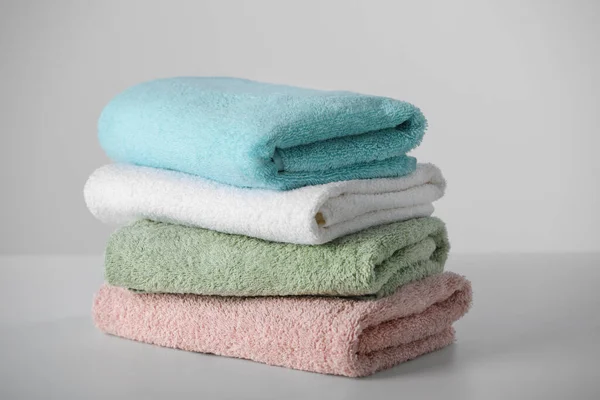 Stack Folded Soft Colorful Towels White Table — Stok fotoğraf