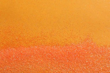 Turuncu arka planda parlak parlak parıltı, düz yatış. Metin için boşluk