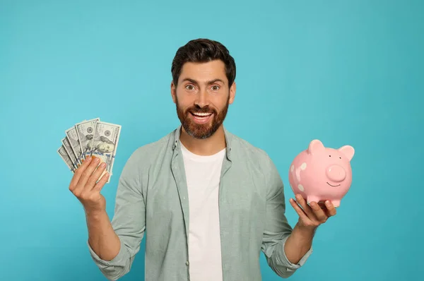 Happy Man Money Ceramic Piggy Bank Light Blue Background — Stock Photo, Image