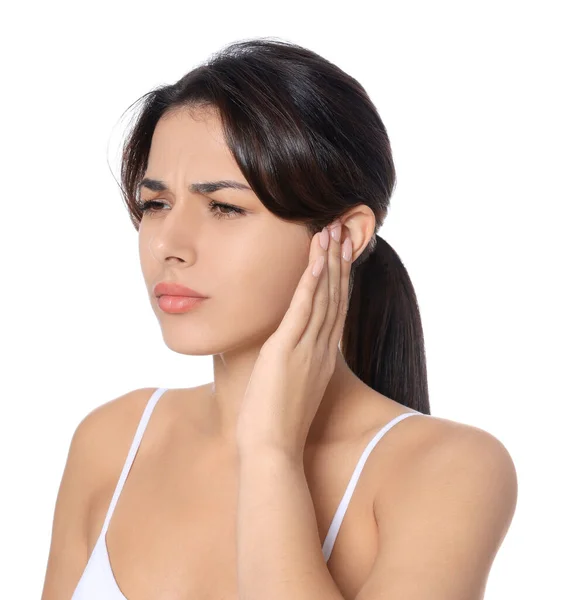 stock image Young woman suffering from ear pain on white background