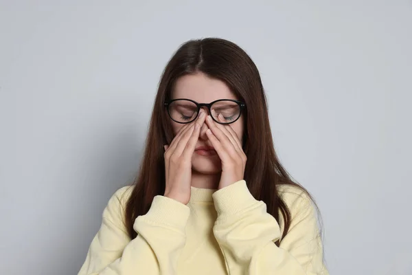 Young Woman Suffering Eyestrain Light Background —  Fotos de Stock