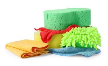 Sponges, cloths and car wash mitt on white background clipart