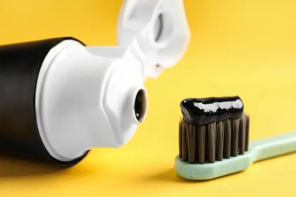 Brush Tube Charcoal Toothpaste Yellow Background Closeup — Stock Photo, Image