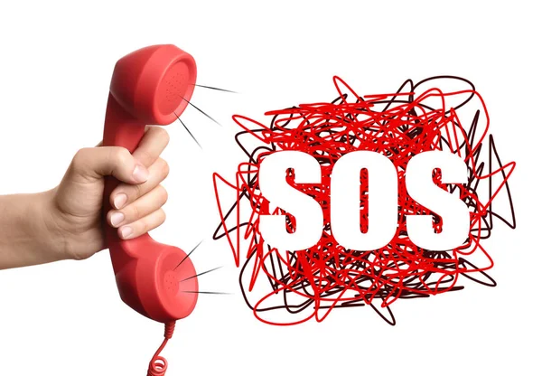 stock image Woman holding telephone handset on white background, closeup. Emergency SOS call