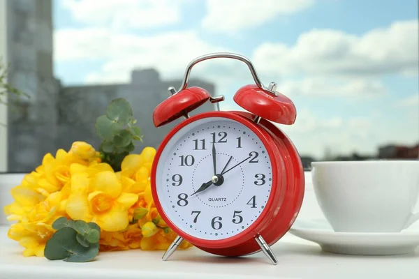 Alarm Clock Beautiful Yellow Freesias Cup Drink Windowsill Good Morning — Stock Photo, Image