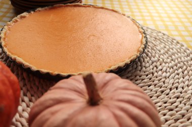 Delicious homemade pumpkin pie in baking dish on table