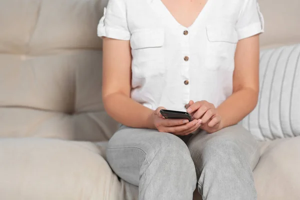 Woman Using Smartphone Sofa Home Closeup — Stock Photo, Image