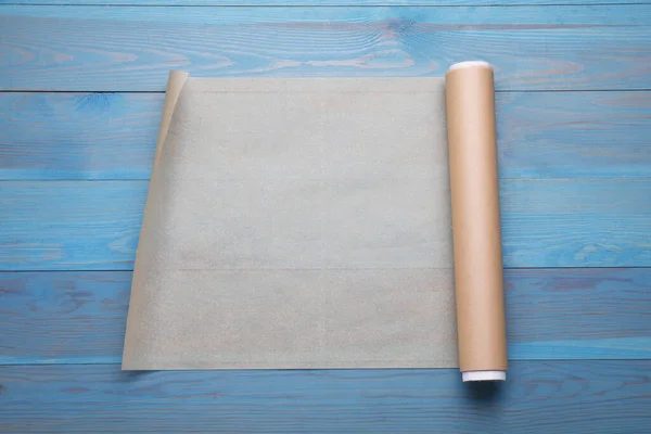 Roll Baking Paper Light Blue Wooden Table Top View — Stock Photo, Image