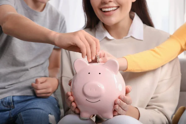 Happy Family Putting Coins Piggy Bank Home Closeup — Stock Photo, Image
